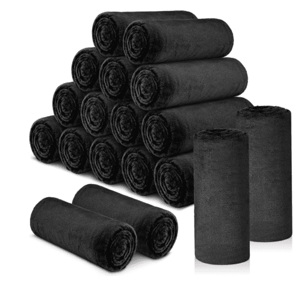 A pile of black rolls sitting next to each other.